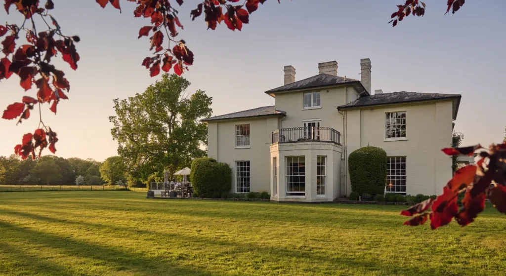 Exterior view of Congham Hall and green lawns